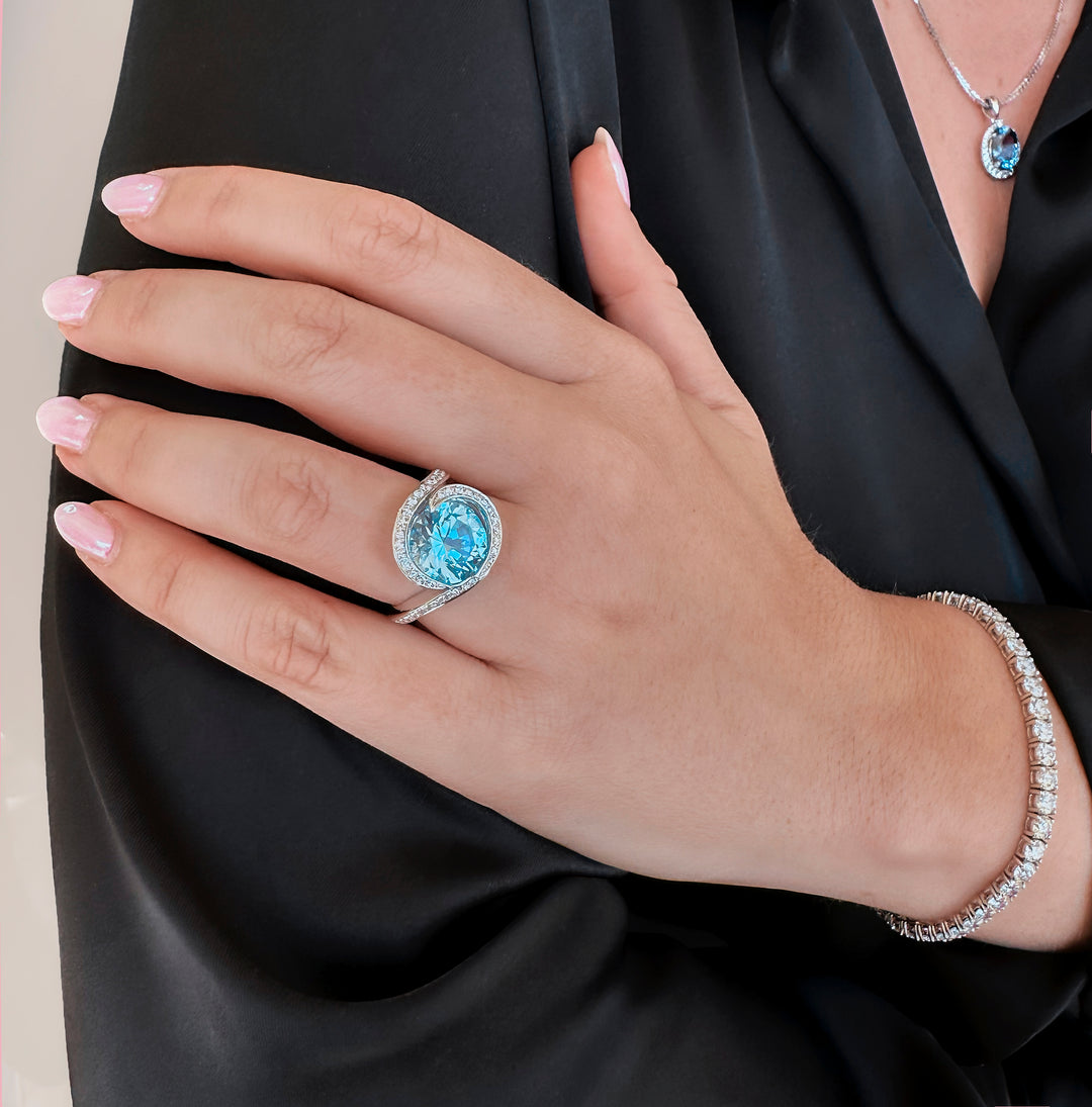 Round Blue Topaz Halo Ring