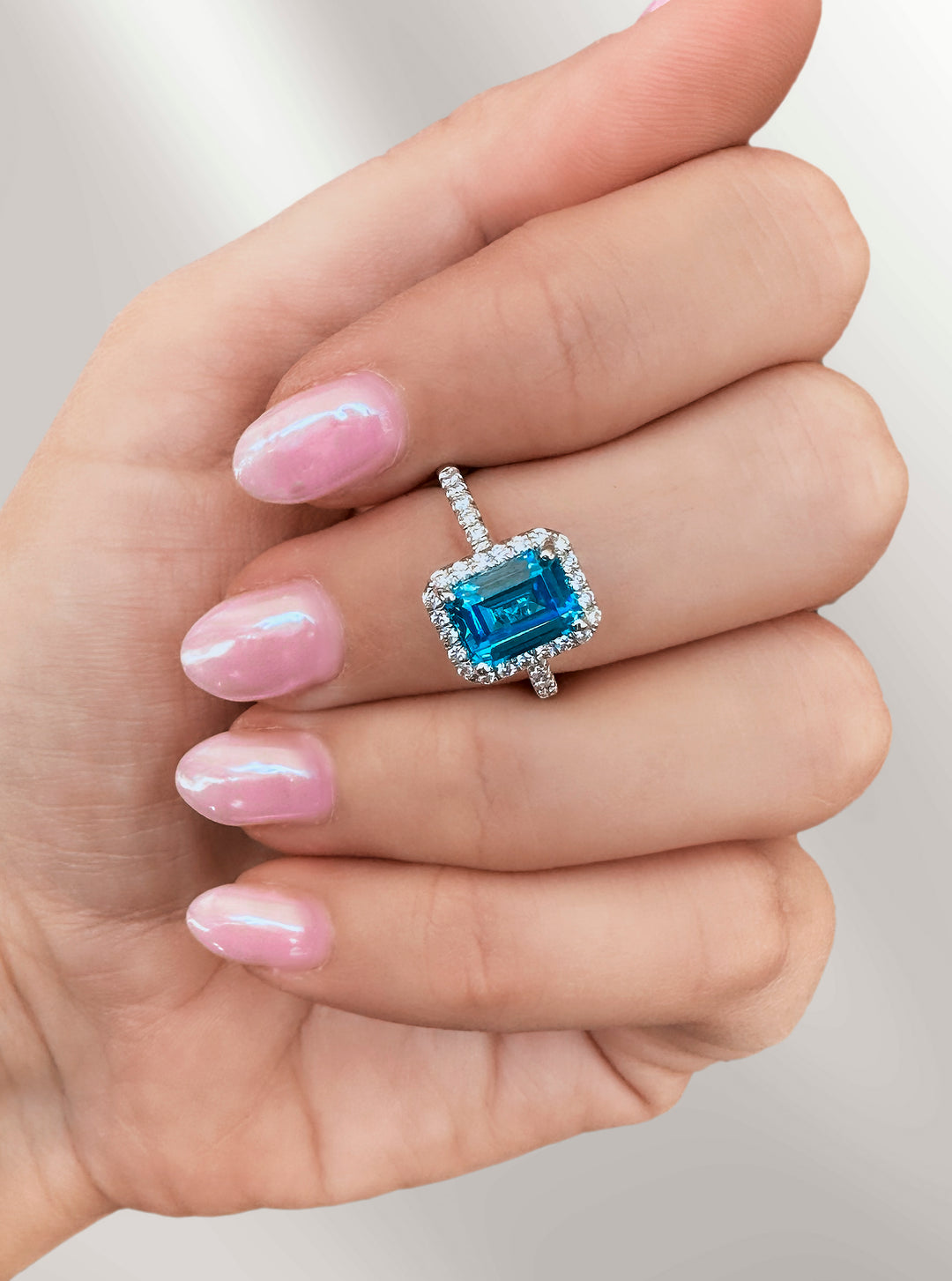 Emerald Cut Blue Topaz Halo Ring