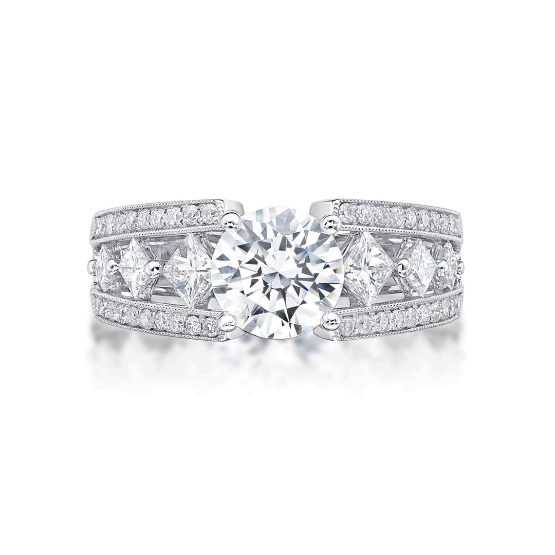 The Bijou is an 18ct white gold featuring Princess cut diamonds single claw set into the shoulders of the band