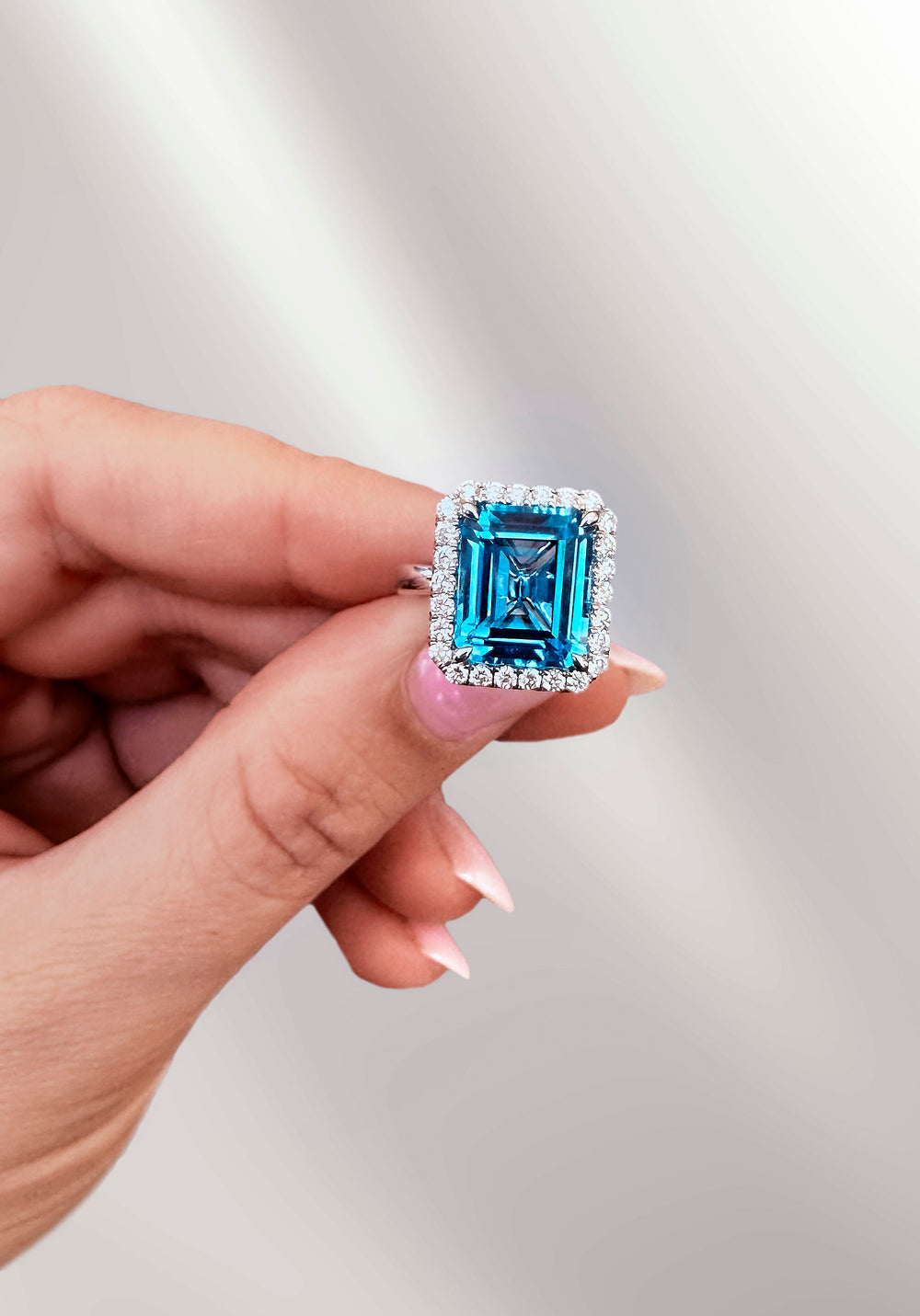 Emerald Cut Blue Topaz Halo Ring