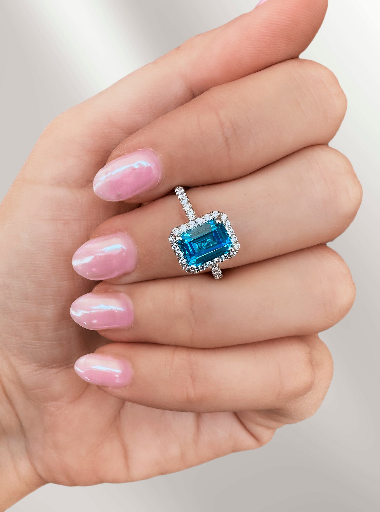Emerald Cut Blue Topaz Halo Ring