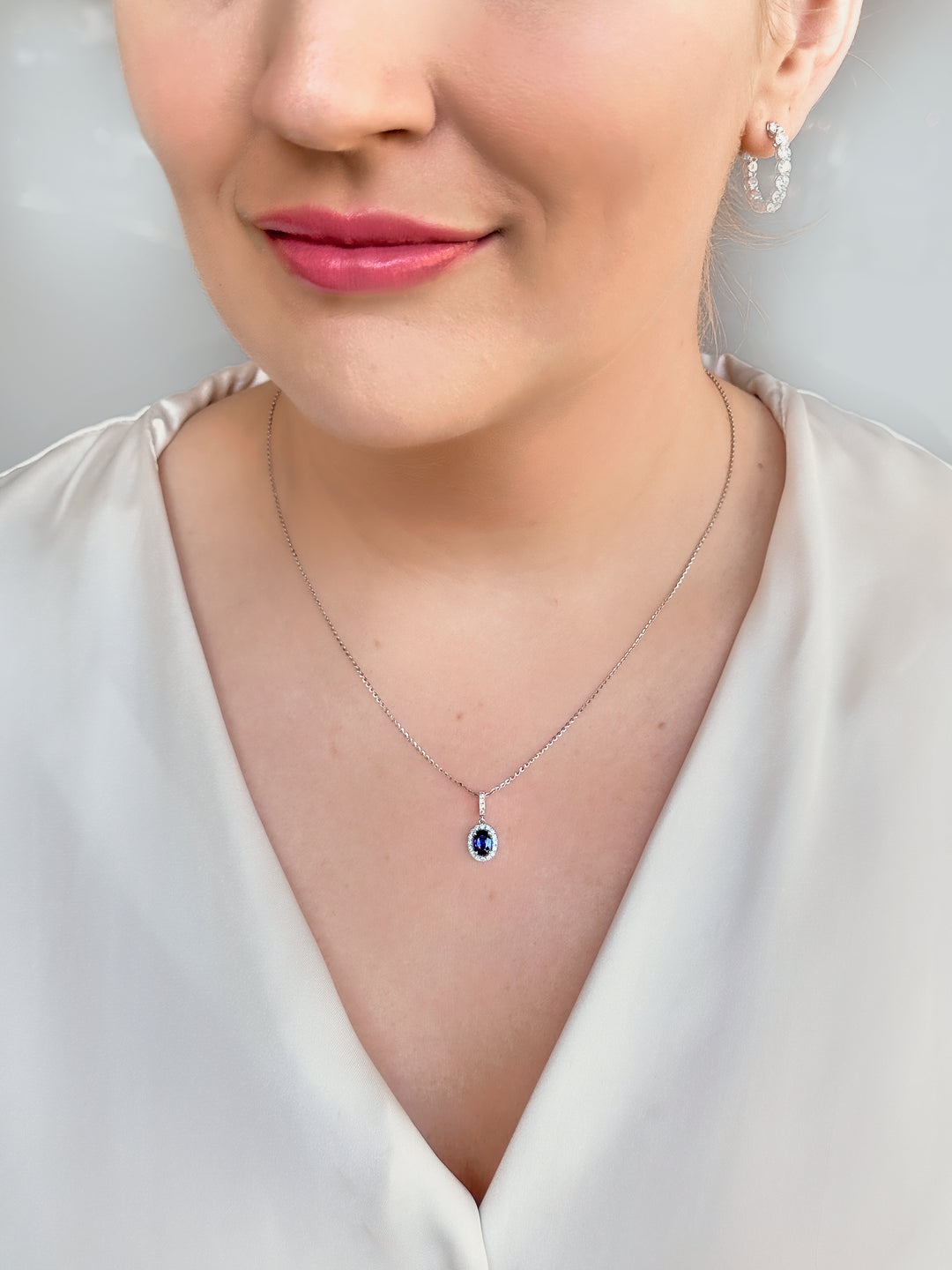 Deep Blue Oval Sapphire and Diamond Pendant